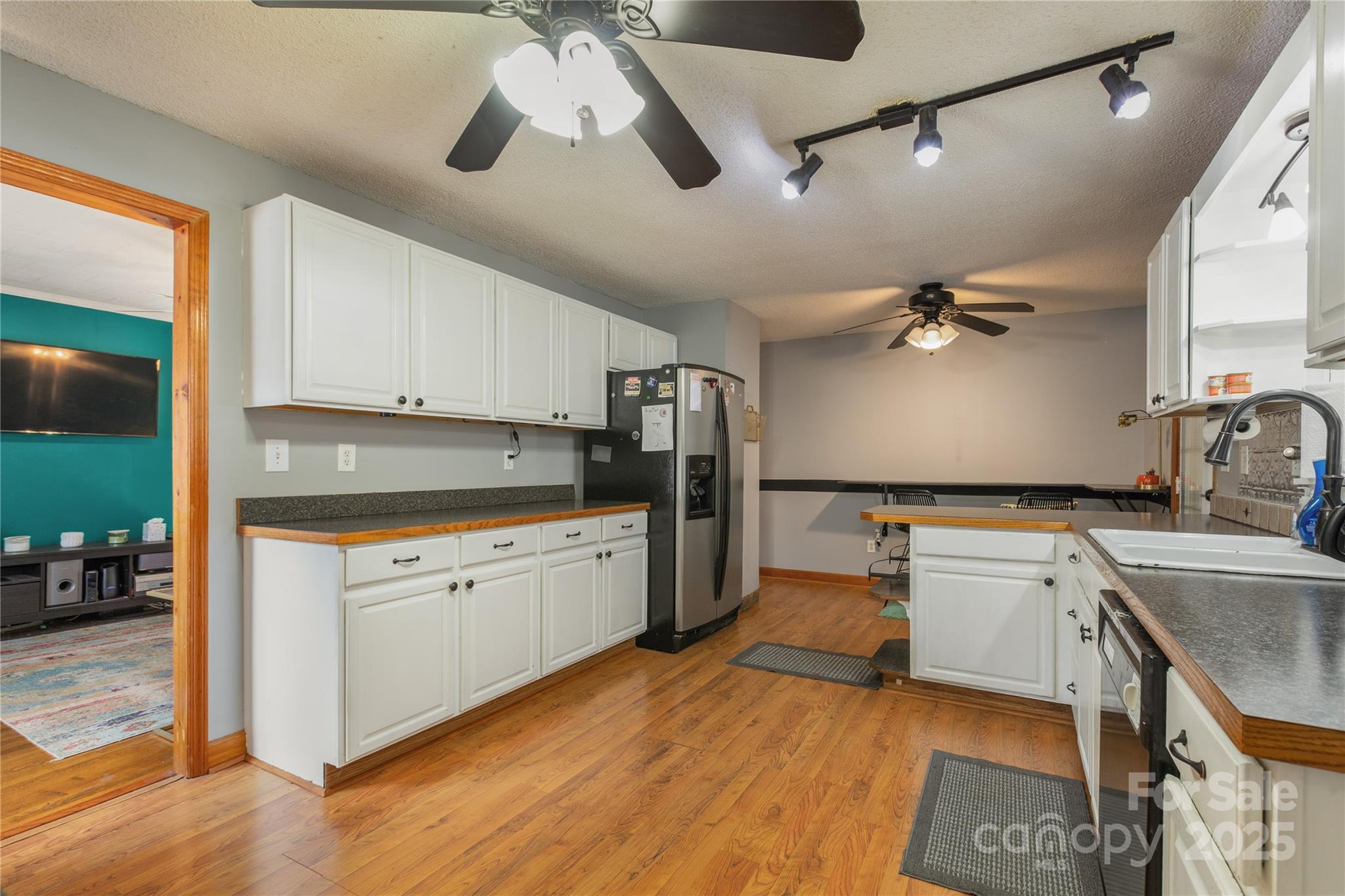 333 Oakview Park Road Asheville, NC 28803 - Photo 5 of 31 a kitchen with a sink stove and refrigerator