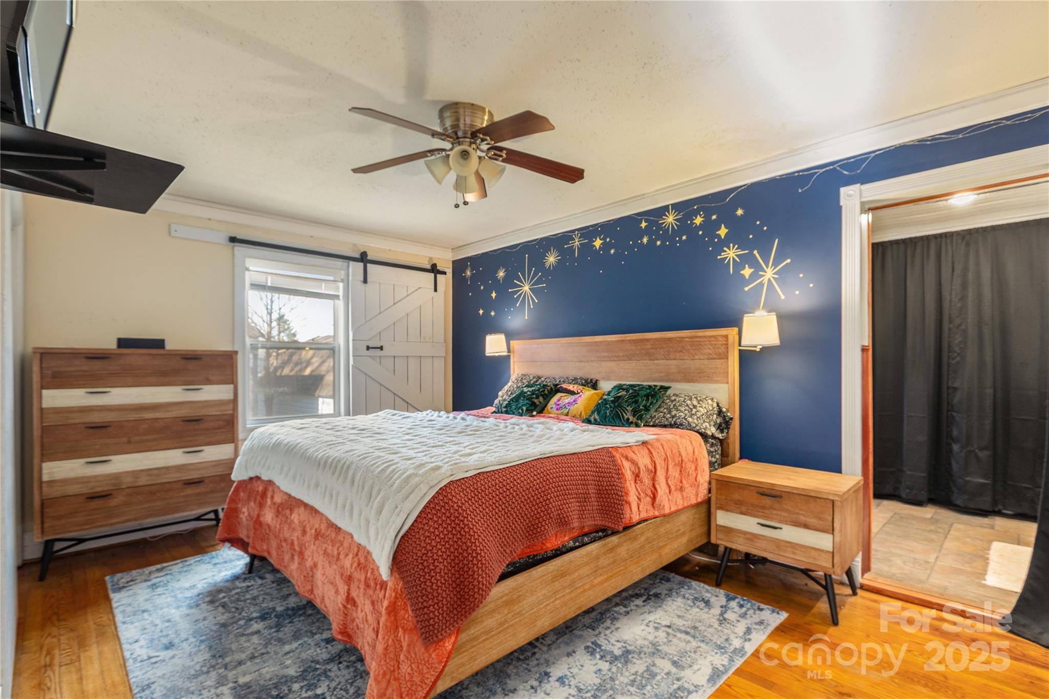 333 Oakview Park Road Asheville, NC 28803 - Photo 10 of 31 a bedroom with a bed and a chandelier