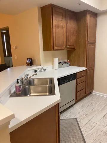a dining room with kitchen island a table and chairs