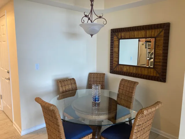 a kitchen with kitchen island a sink dishwasher stove and refrigerator with wooden cabinet