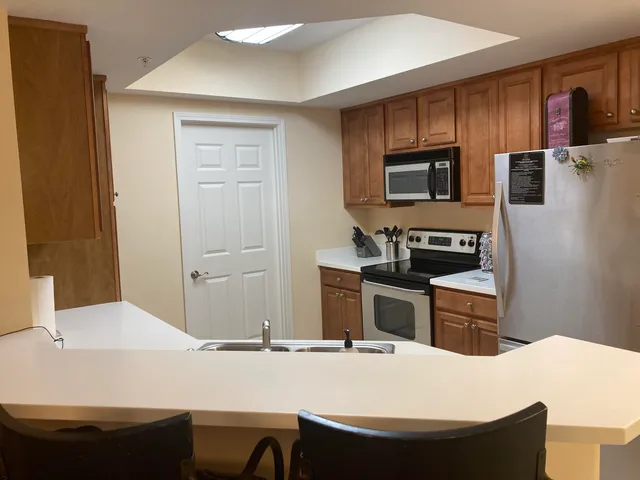 a bedroom with a large bed and a balcony view