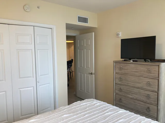 a bed room with a bed and a lamp