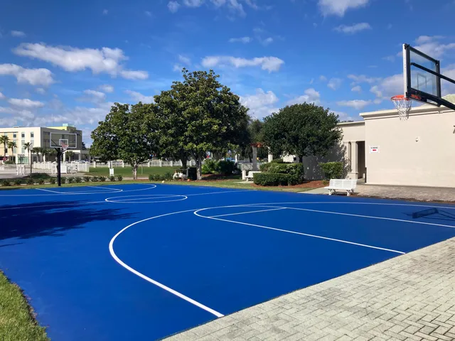 a view of a house with pool and sitting area