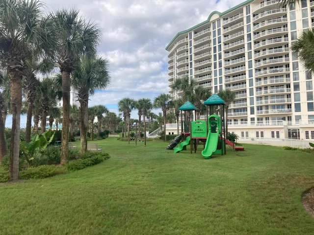 a view of swimming pool with outdoor seating and plants