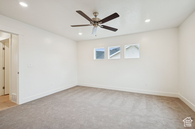 1615 North Angel Street, Unit E Layton, UT 84041 - Photo 22 of 42 Unfurnished room with light carpet, recessed lighting, and ceiling fan