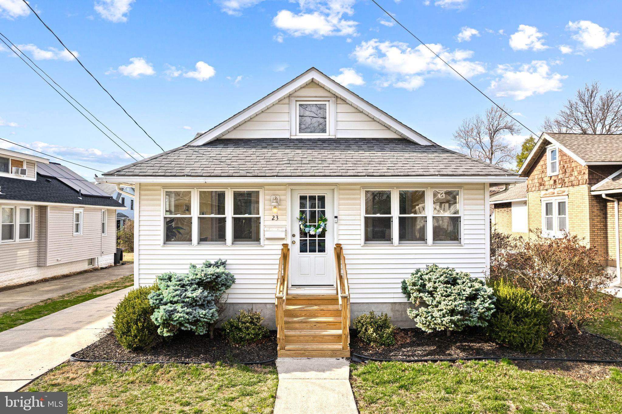23 Ormond Avenue Haddon Township, NJ 08107 - Photo 1 of 34 a front view of a house with a yard and potted plants