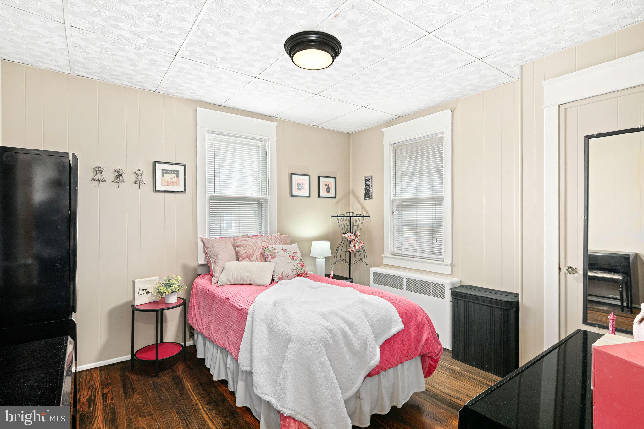 23 Ormond Avenue Haddon Township, NJ 08107 - Photo 17 of 34 a bedroom with a bed and a flat tv screen on dresser