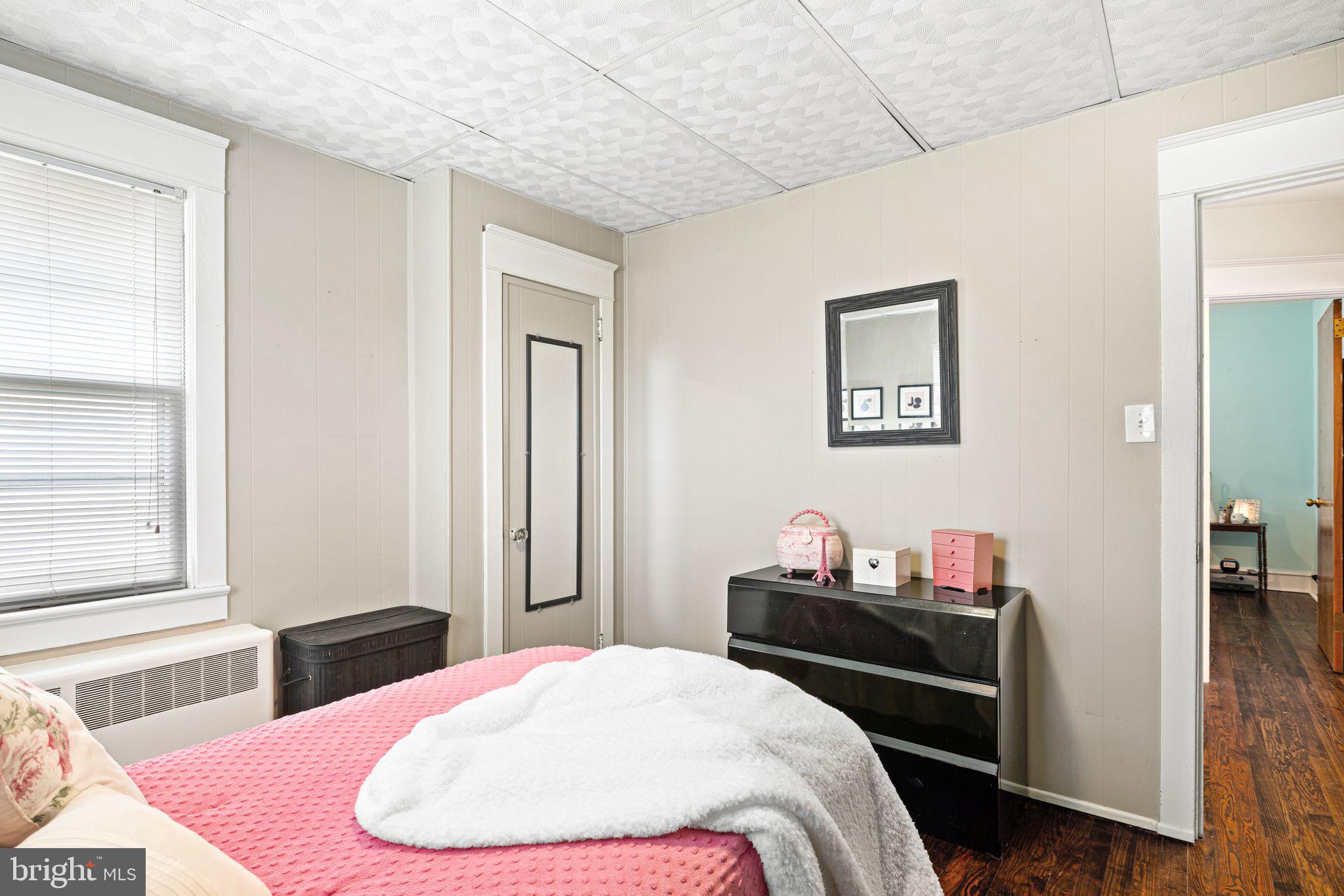 23 Ormond Avenue Haddon Township, NJ 08107 - Photo 18 of 34 a bedroom with a bed and wooden floor