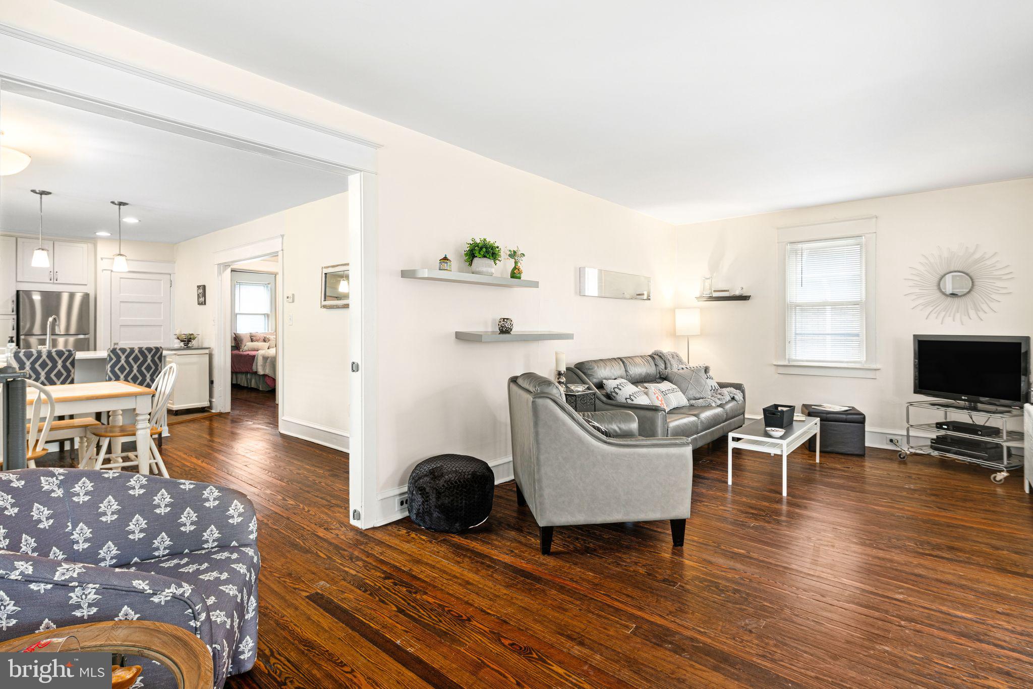 23 Ormond Avenue Haddon Township, NJ 08107 - Photo 5 of 34 a living room with furniture a wooden floor and a flat screen tv