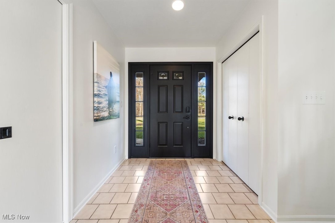 3520 Hunting Run Road Medina, OH 44256 - Photo 6 of 47 Entrance foyer featuring light tile patterned floors