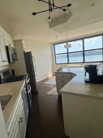 a view of a storage & utility room with two washing machine