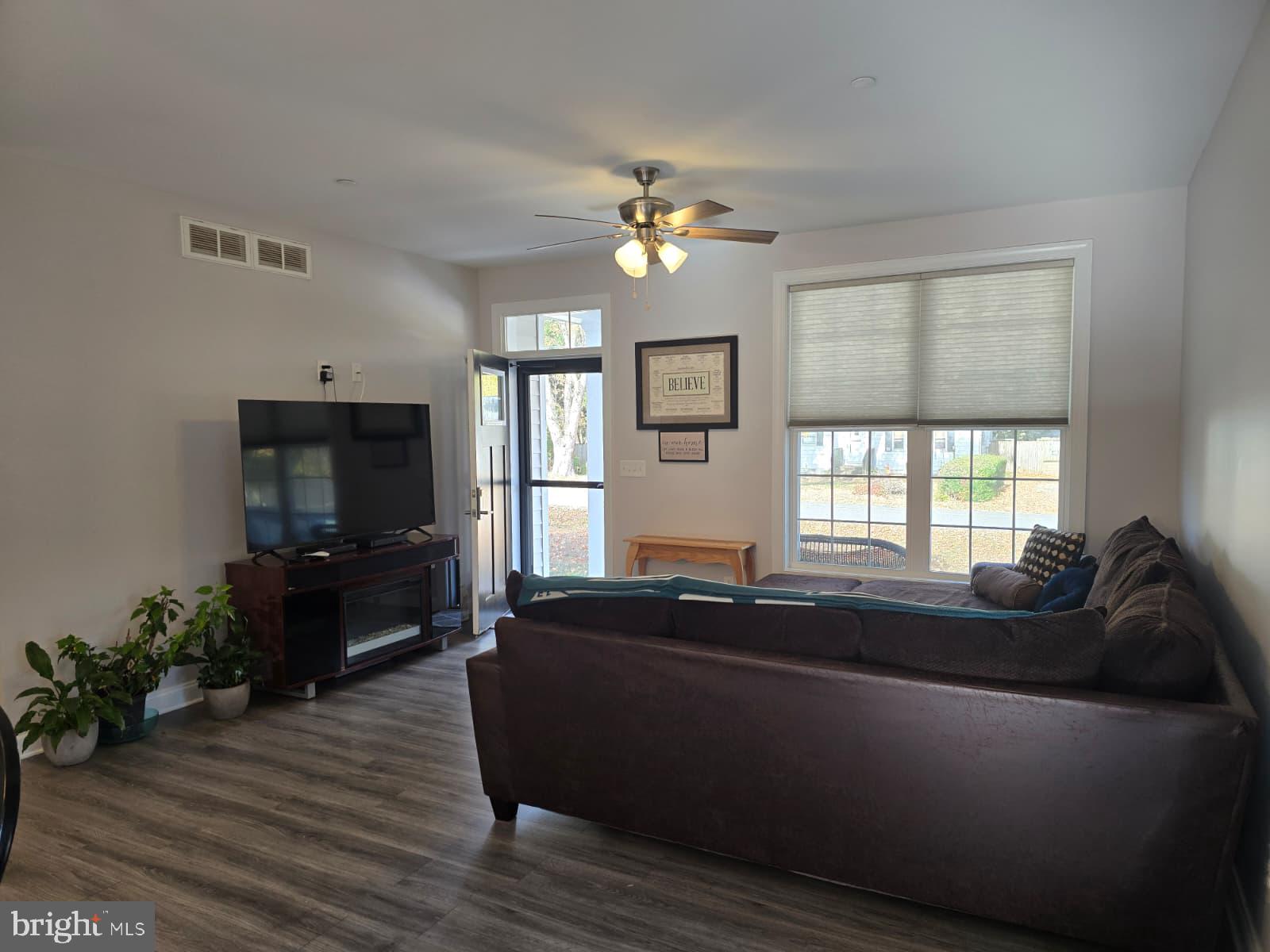 209 3rd Street Crumpton, MD 21628 - Photo 14 of 53 a living room with furniture and a flat screen tv