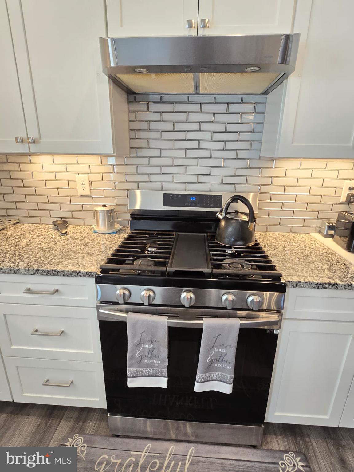 209 3rd Street Crumpton, MD 21628 - Photo 22 of 53 a stove top oven sitting inside of a kitchen