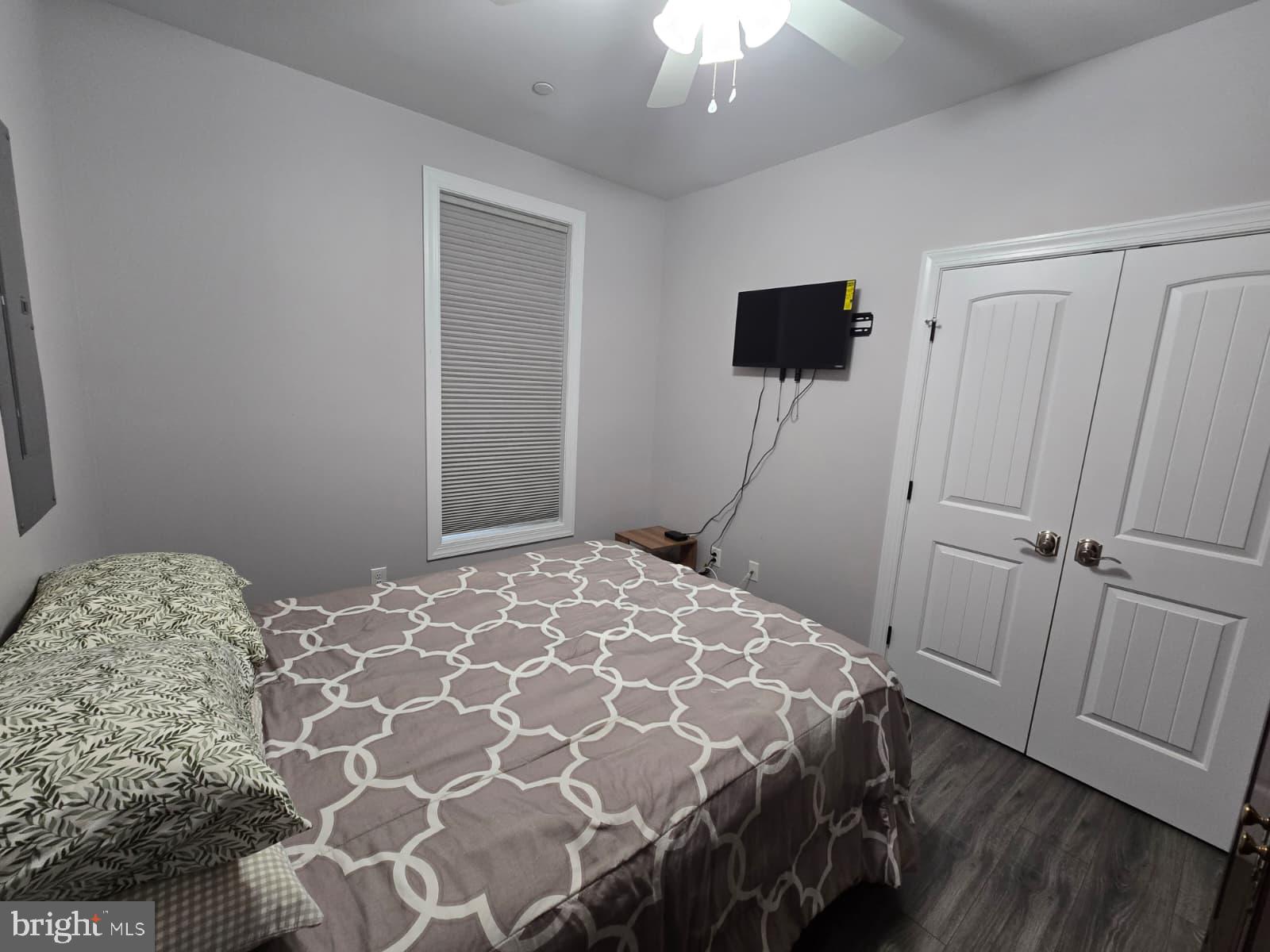 209 3rd Street Crumpton, MD 21628 - Photo 31 of 53 a bedroom with a bed and a flat screen tv