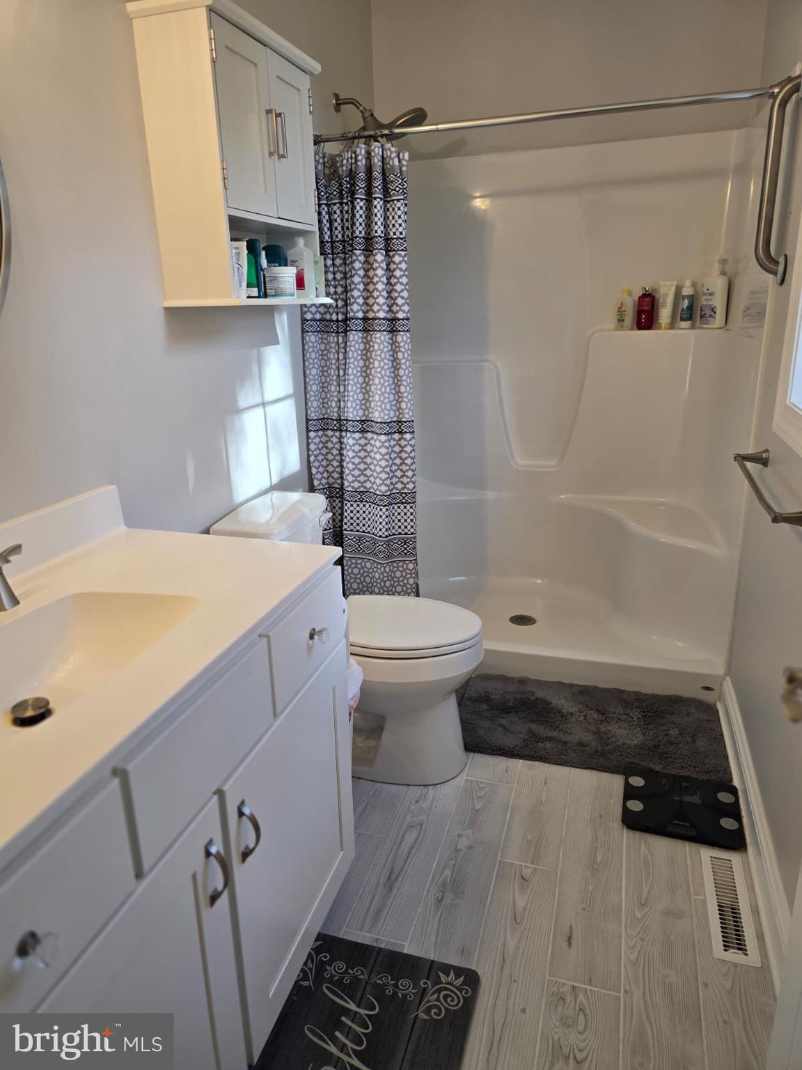 209 3rd Street Crumpton, MD 21628 - Photo 42 of 53 a bathroom with a sink a toilet and shower