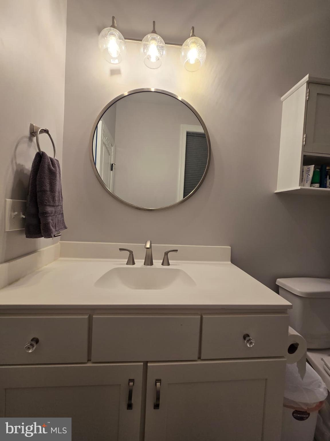 209 3rd Street Crumpton, MD 21628 - Photo 49 of 53 a bathroom with a sink and a mirror