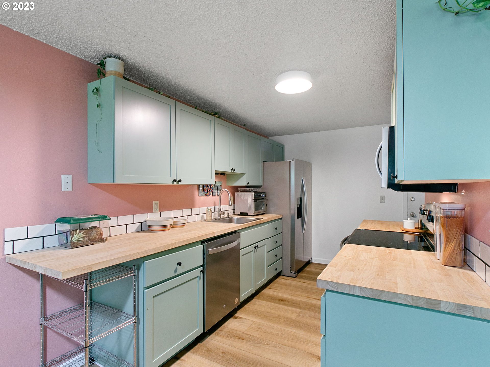 2369 Southeast 112th Avenue, Unit 7 Portland, OR 97216 - Photo 11 of 32 a kitchen with a sink cabinets and wooden floor