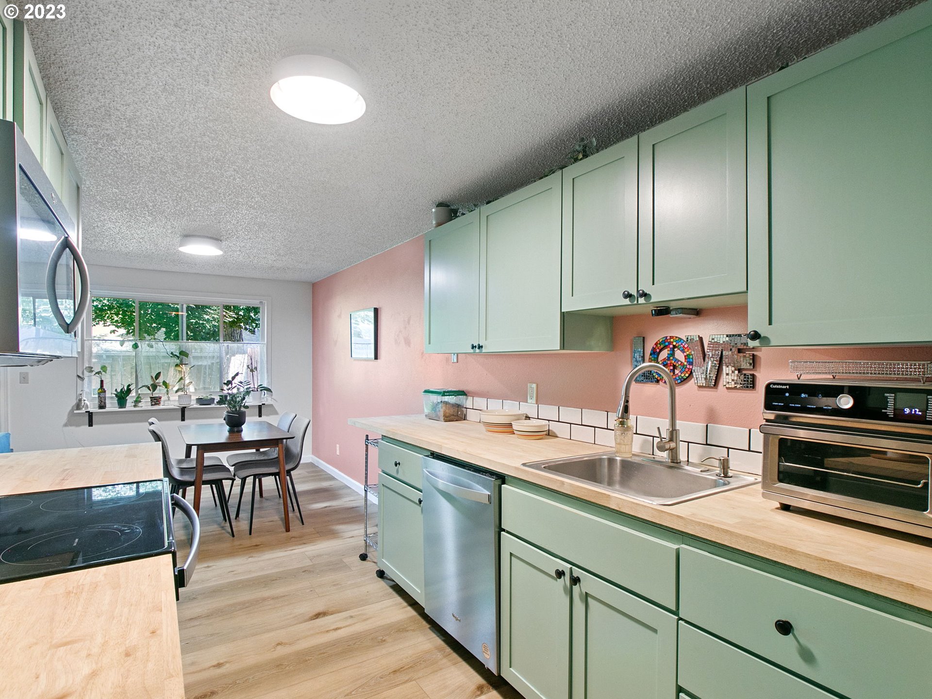 2369 Southeast 112th Avenue, Unit 7 Portland, OR 97216 - Photo 13 of 32 a kitchen with a sink and cabinets