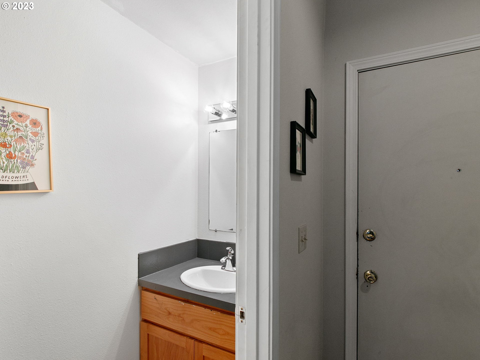 2369 Southeast 112th Avenue, Unit 7 Portland, OR 97216 - Photo 17 of 32 a bathroom with a granite countertop sink