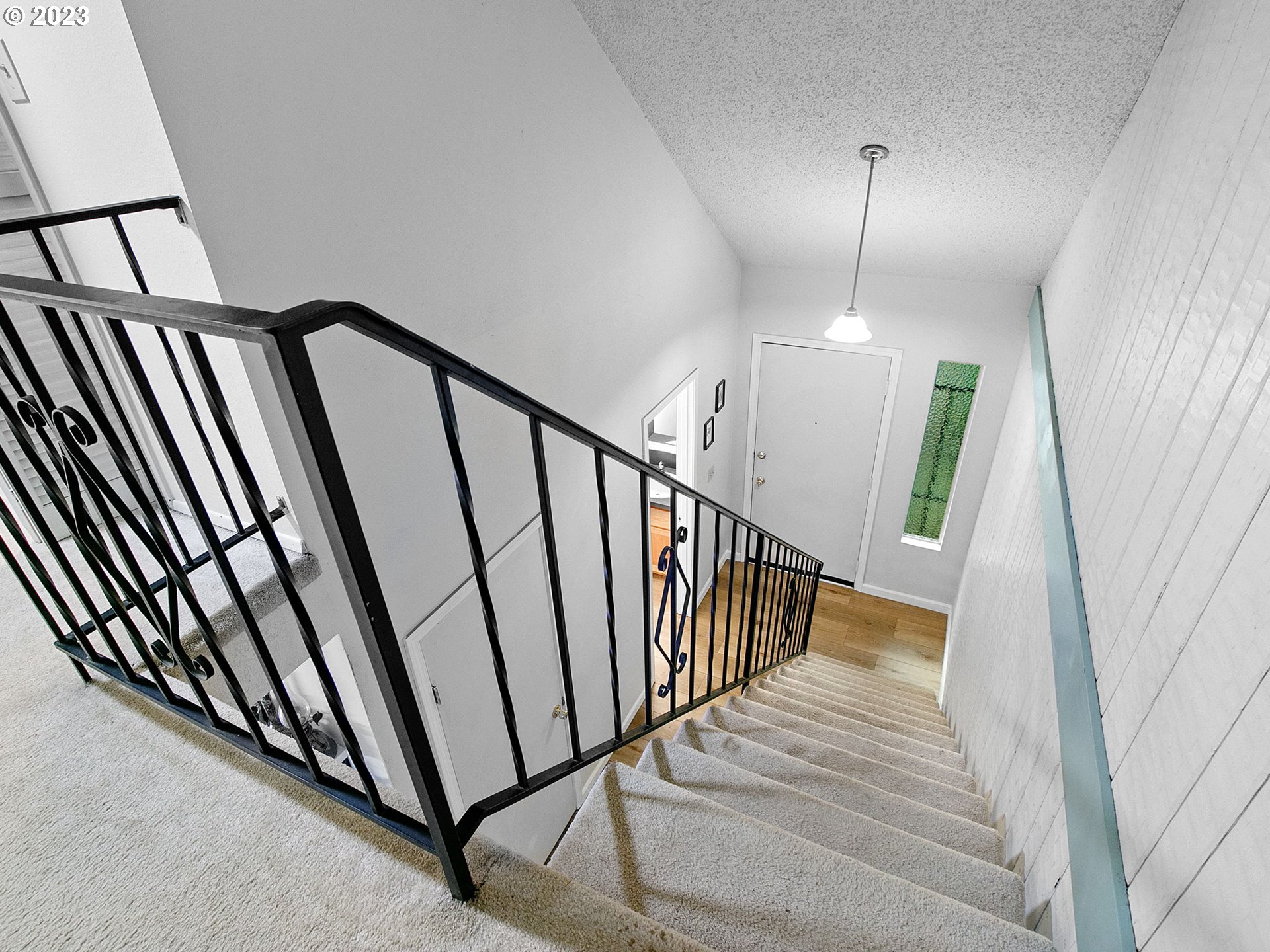 2369 Southeast 112th Avenue, Unit 7 Portland, OR 97216 - Photo 18 of 32 a view of staircase with railing and white walls