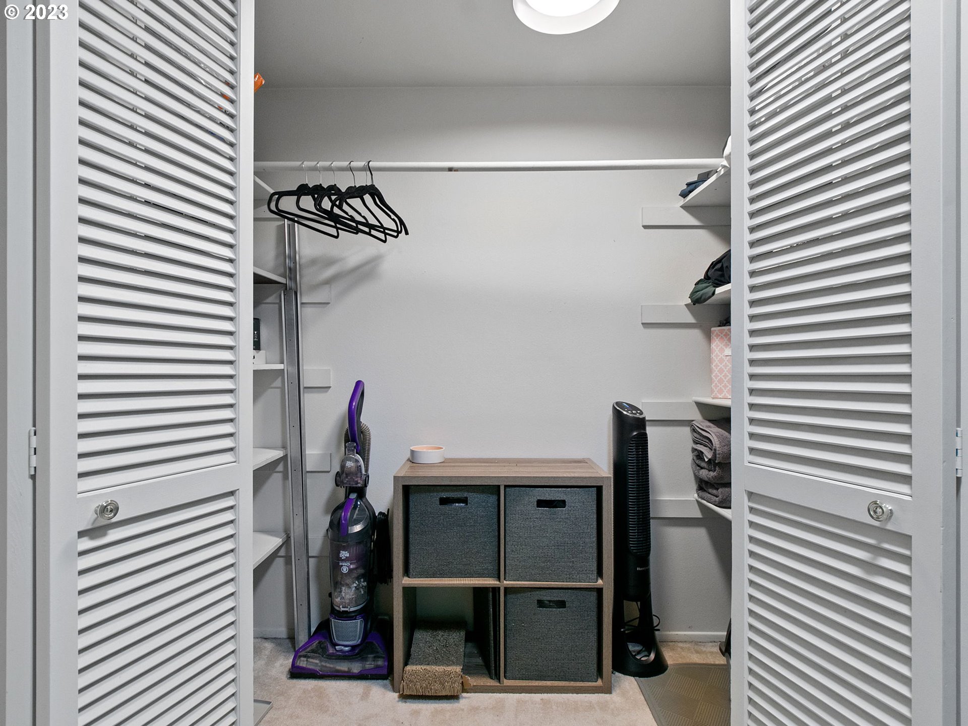 2369 Southeast 112th Avenue, Unit 7 Portland, OR 97216 - Photo 20 of 32 a view of a room with rack on the wall