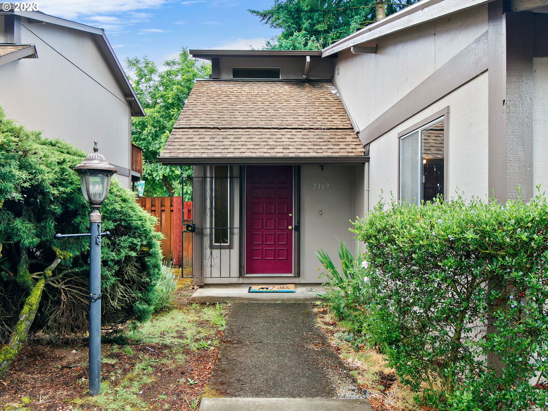 2369 Southeast 112th Avenue, Unit 7 Portland, OR 97216 - Photo 2 of 32 a front view of a house with porch