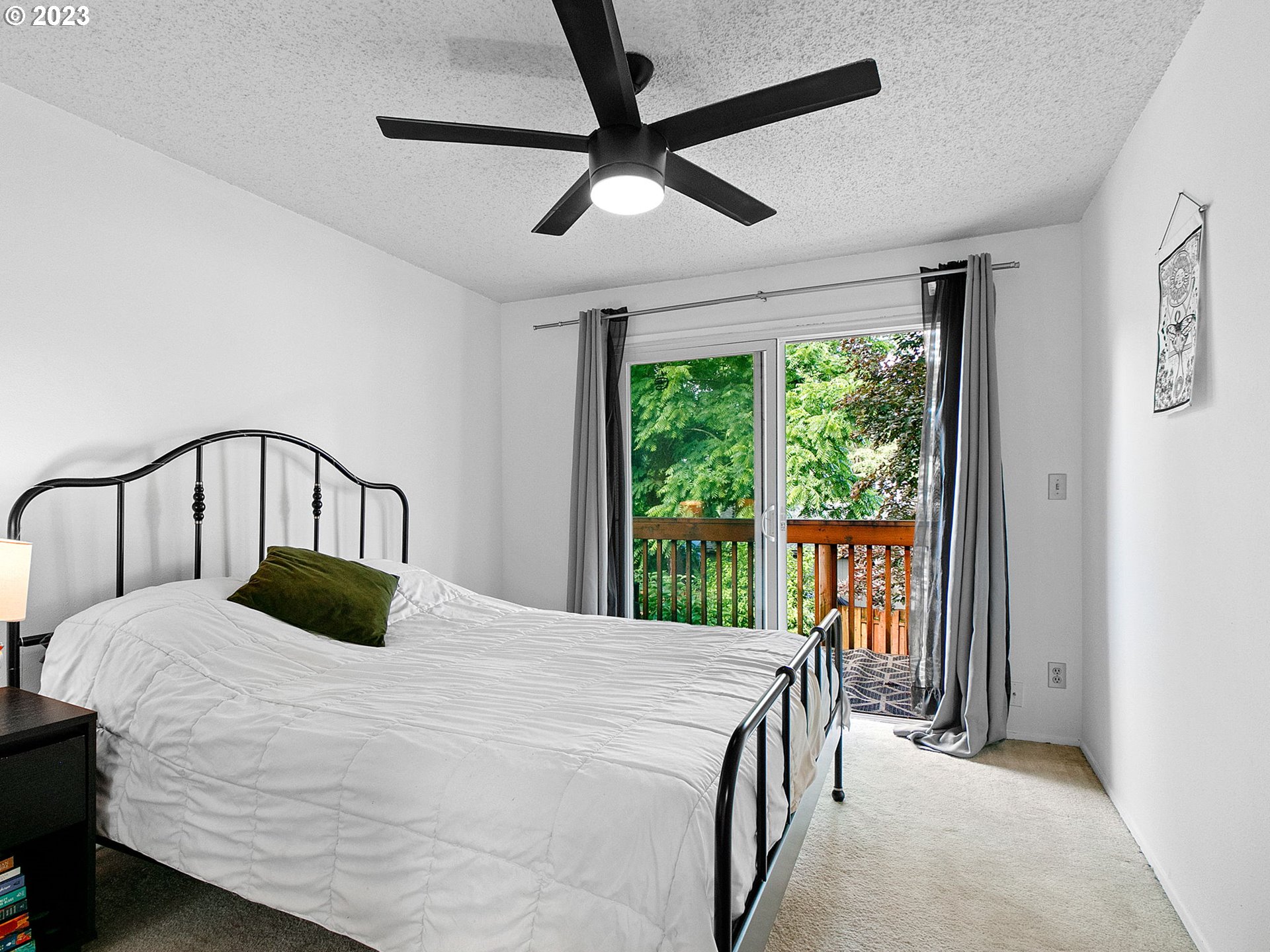 2369 Southeast 112th Avenue, Unit 7 Portland, OR 97216 - Photo 22 of 32 a bedroom with a bed next to a large window