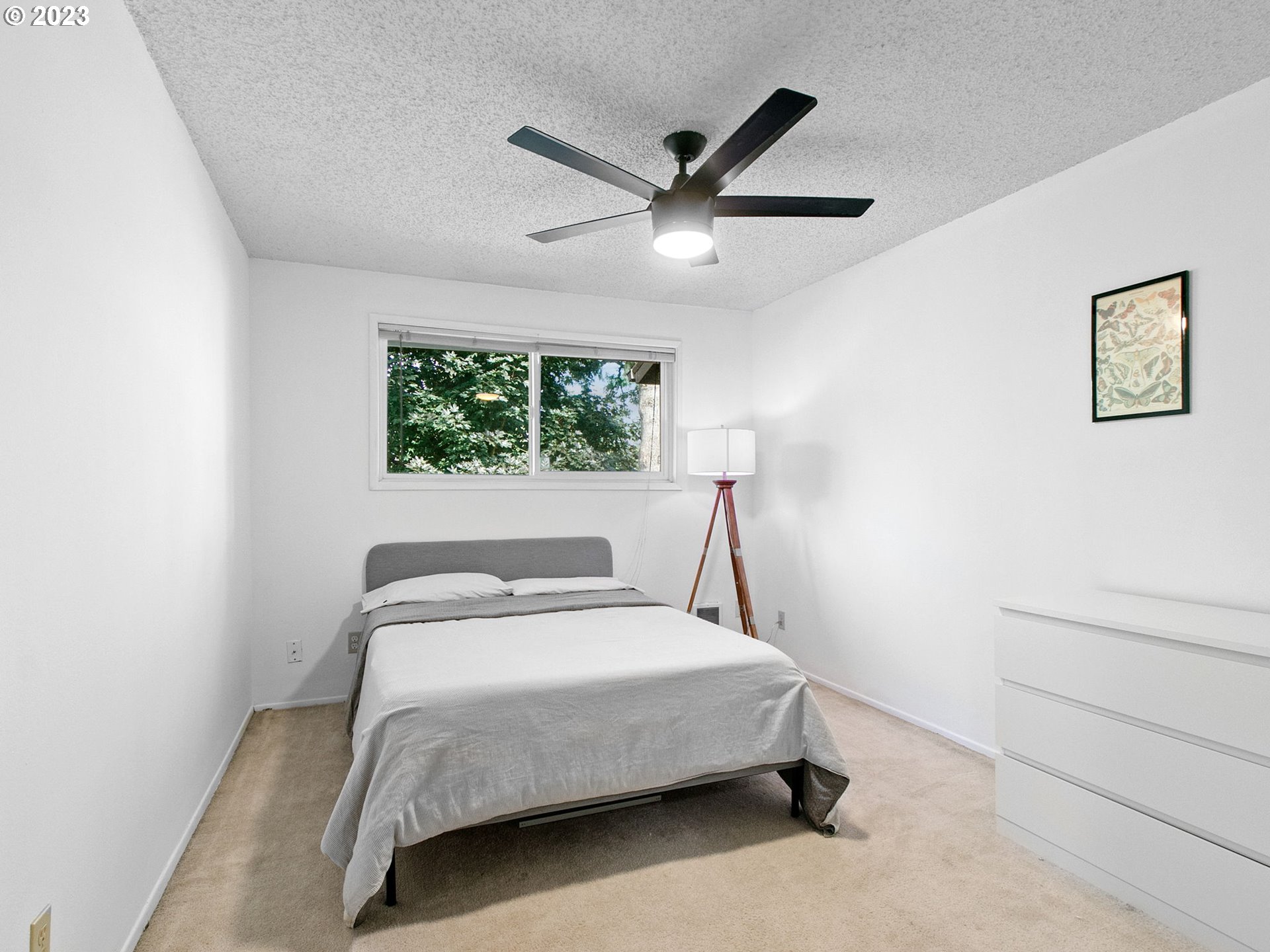2369 Southeast 112th Avenue, Unit 7 Portland, OR 97216 - Photo 25 of 32 a bedroom with a bed and a window