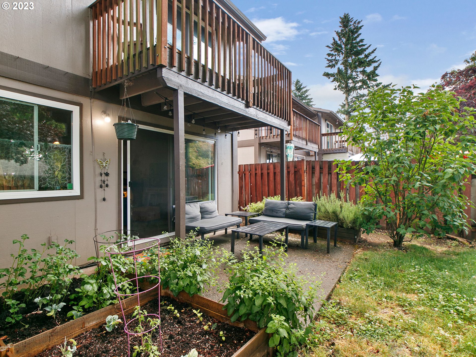 2369 Southeast 112th Avenue, Unit 7 Portland, OR 97216 - Photo 27 of 32 a backyard of a house with outdoor seating