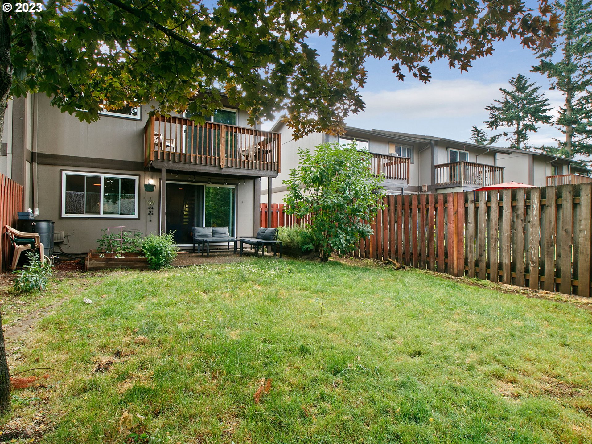 2369 Southeast 112th Avenue, Unit 7 Portland, OR 97216 - Photo 28 of 32 a view of backyard of house with green space