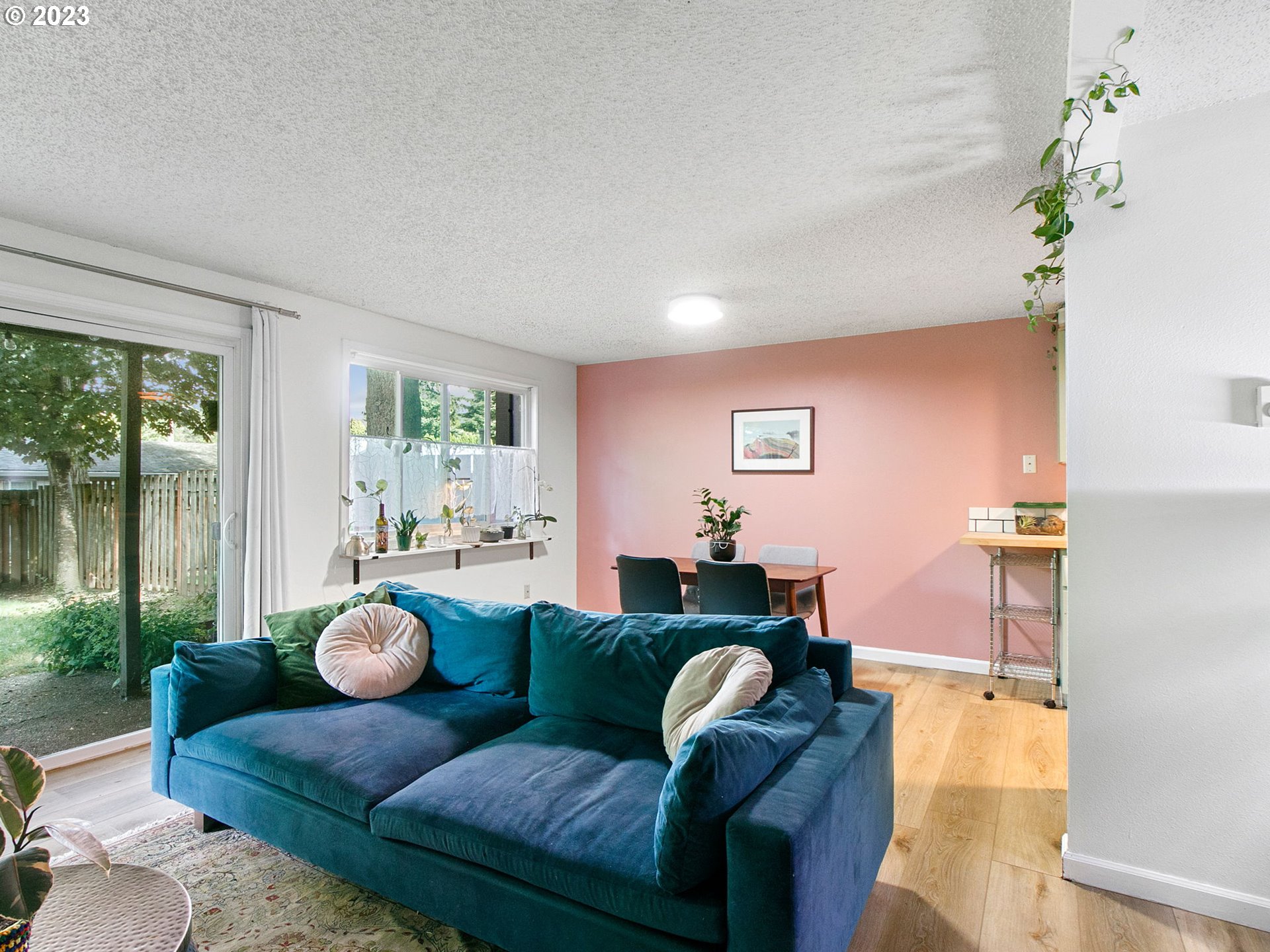 2369 Southeast 112th Avenue, Unit 7 Portland, OR 97216 - Photo 5 of 32 a living room with furniture and a floor to ceiling window