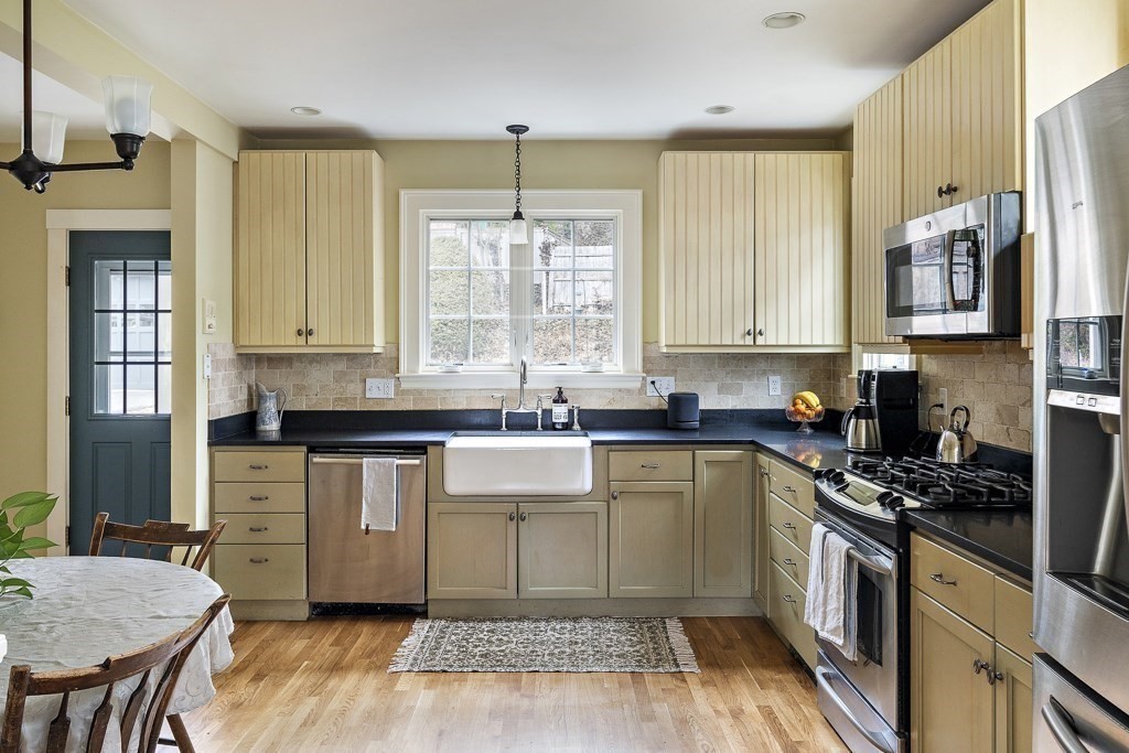 39 Somerset Road Brookline, MA 02445 - Photo 20 of 41 a kitchen with stainless steel appliances granite countertop a stove a sink and a refrigerator