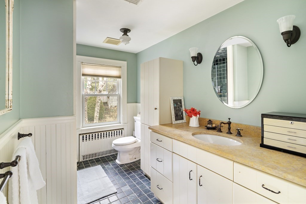 39 Somerset Road Brookline, MA 02445 - Photo 28 of 41 a bathroom with a toilet sink and mirror