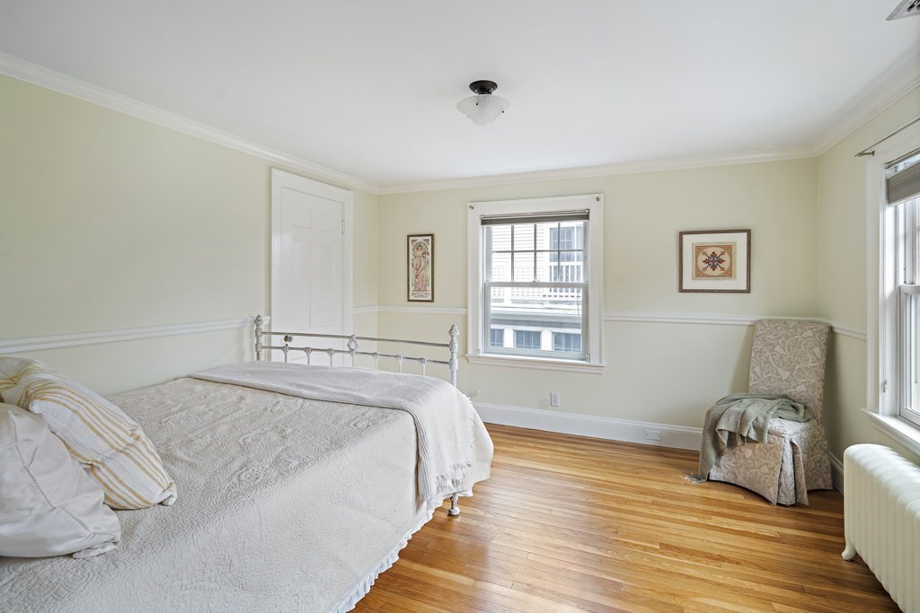 39 Somerset Road Brookline, MA 02445 - Photo 31 of 41 a spacious bedroom with a bed and wooden floor