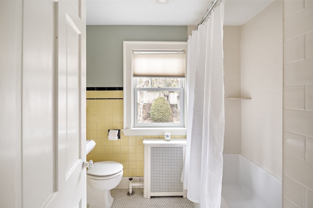 39 Somerset Road Brookline, MA 02445 - Photo 32 of 41 a bathroom with a toilet a sink and a window