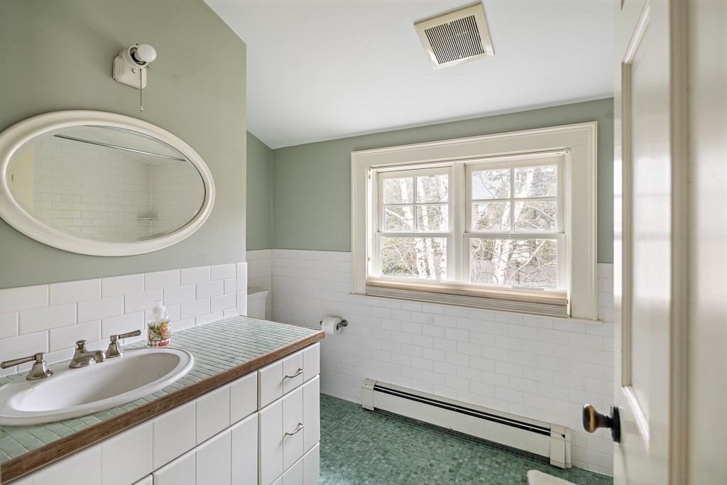 39 Somerset Road Brookline, MA 02445 - Photo 36 of 41 a bathroom with a granite countertop sink and a mirror