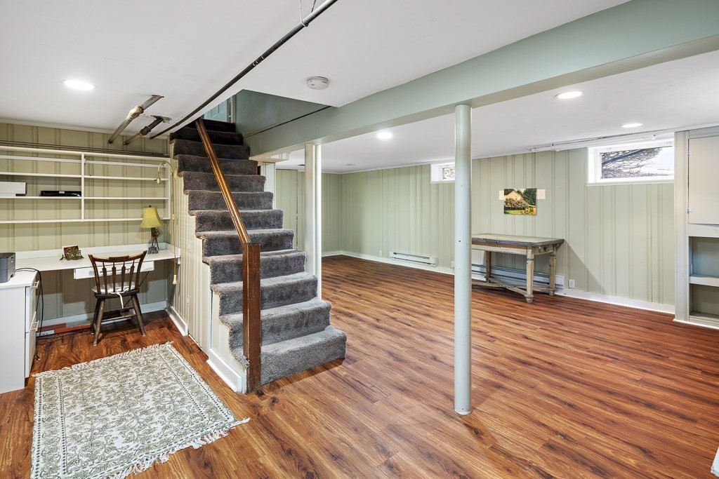 39 Somerset Road Brookline, MA 02445 - Photo 39 of 41 a view of a hardwood floor and staircase in a room