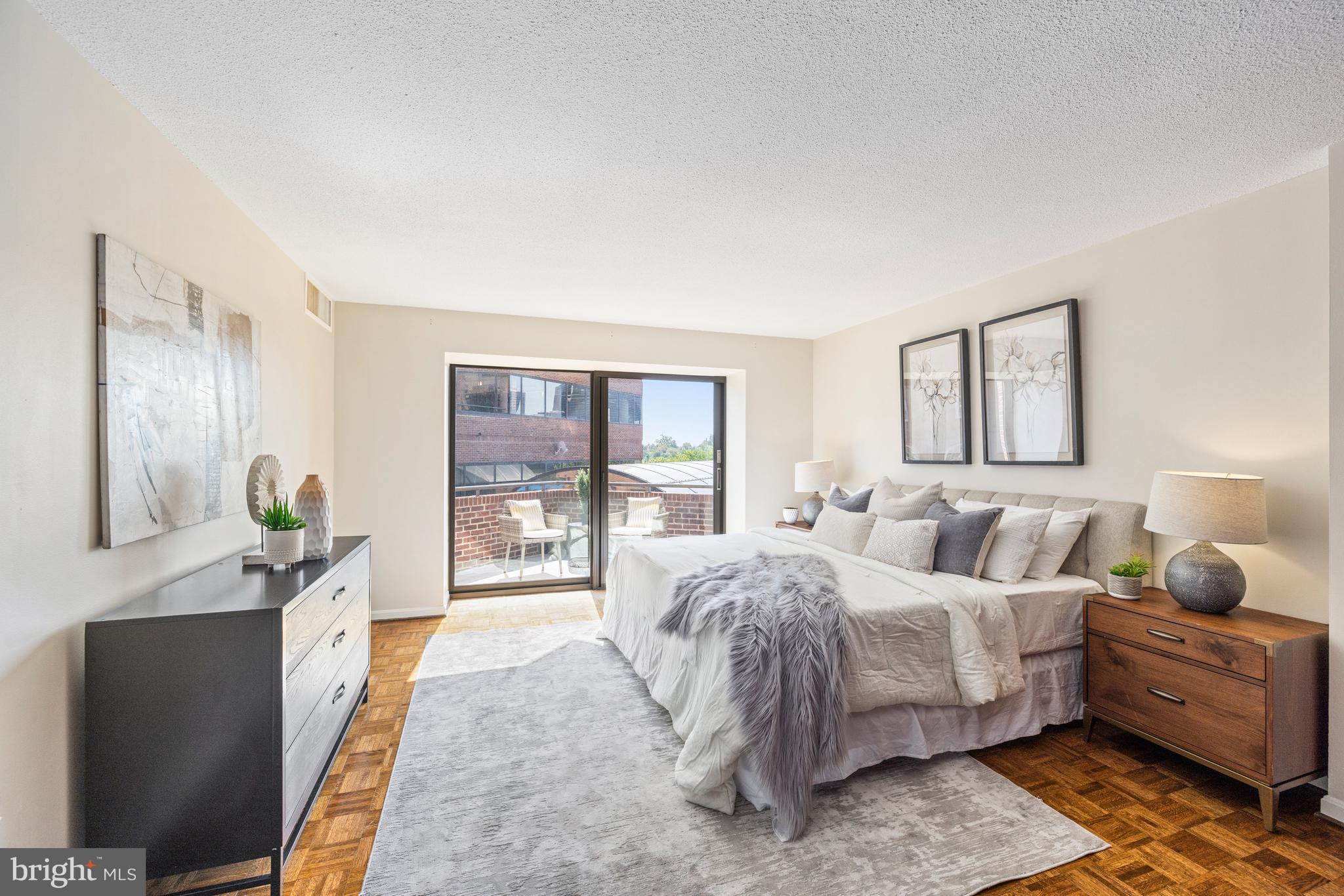 1015 33rd Street Northwest, Unit 507 Washington, DC 20007 - Photo 9 of 20 a bedroom with a bed and large window