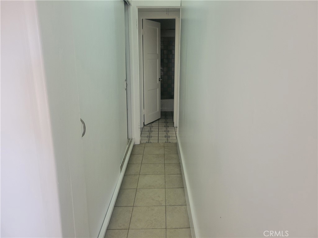 2047 Cambridge Street, Unit A Los Angeles, CA 90006 - Photo 7 of 10 a view of a hallway with wooden floor and a door
