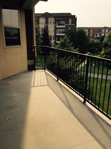 720 Prestwick Lane, Unit 303 Wheeling, IL 60090 - Photo 14 of 15 a view of balcony with furniture