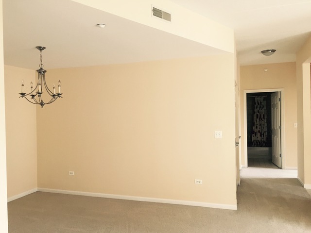 720 Prestwick Lane, Unit 303 Wheeling, IL 60090 - Photo 5 of 15 a view of a room with a shower