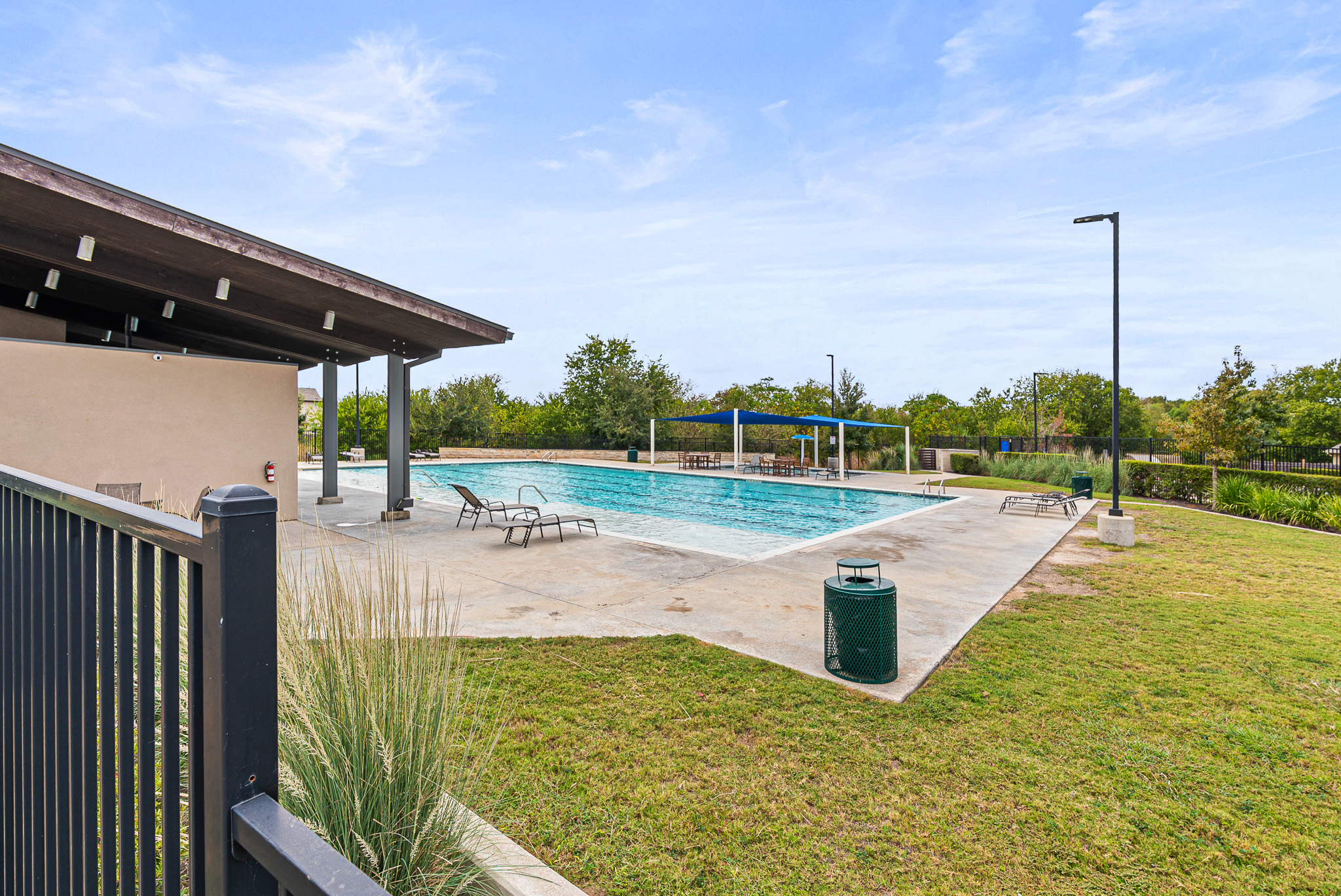 136 Copper Lane Kyle, TX 78640 - Photo 33 of 33 Community pool with a patio