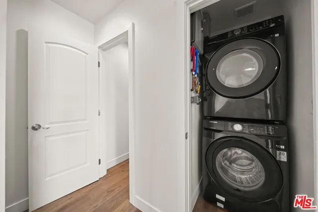 a view of a hallway with washer and dryer