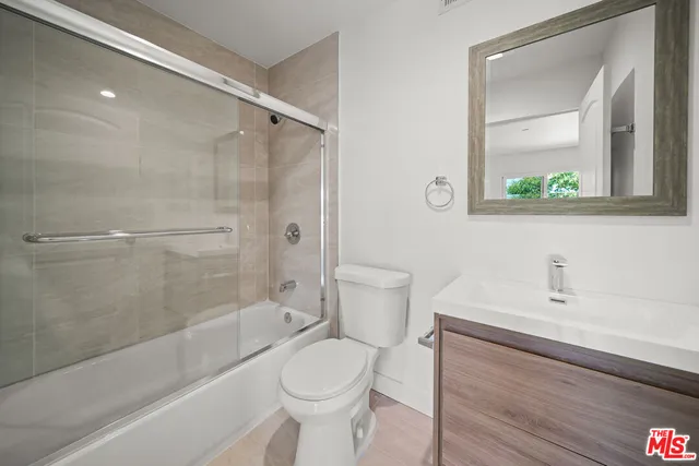 a bathroom with a bathtub toilet and sink