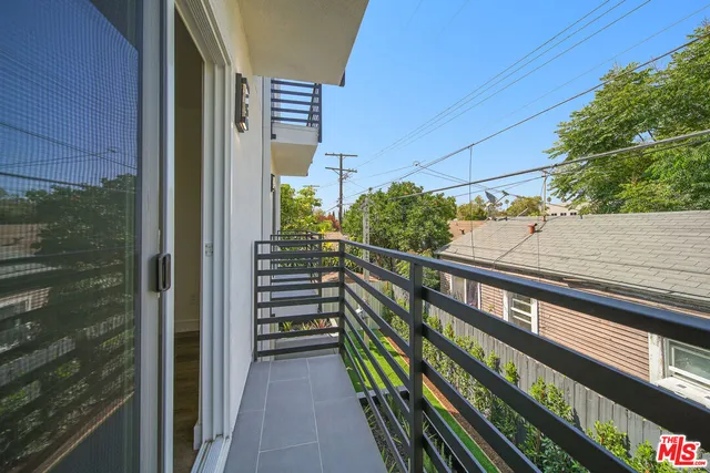 a view of a balcony with an outdoor space