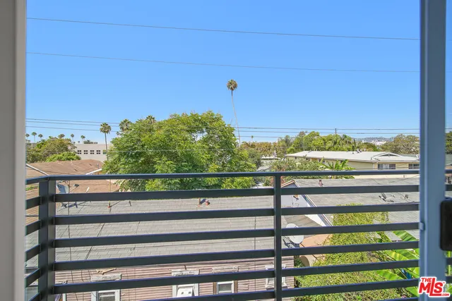 a view of a city skyline from a balcony