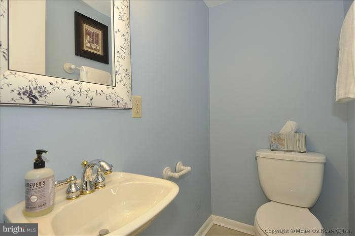 2521 Forest Glen Road Silver Spring, MD 20910 - Photo 12 of 30 POWDER ROOM WITH PEDESTAL SINK AND TILE FLOOR