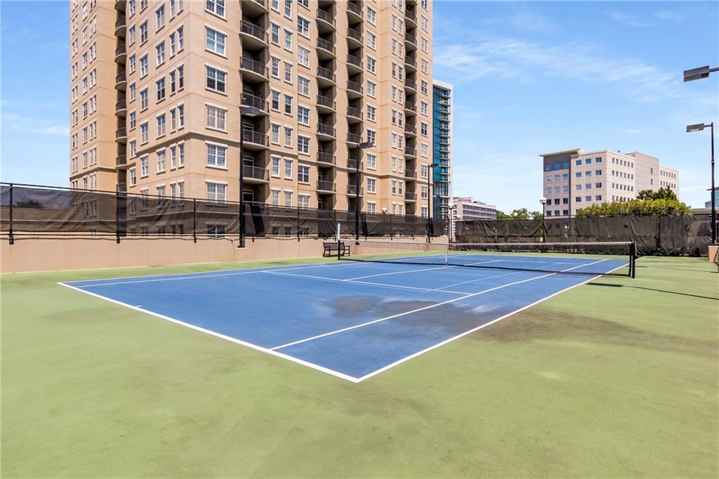 325 East Paces Ferry Road Northeast, Unit 1704 Atlanta, GA 30305 - Photo 20 of 29 a building with trees in front of it