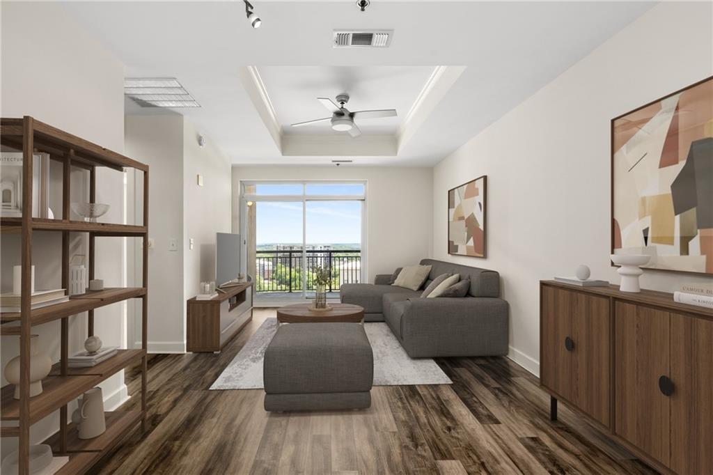 325 East Paces Ferry Road Northeast, Unit 1704 Atlanta, GA 30305 - Photo 2 of 29 a living room with furniture and a window