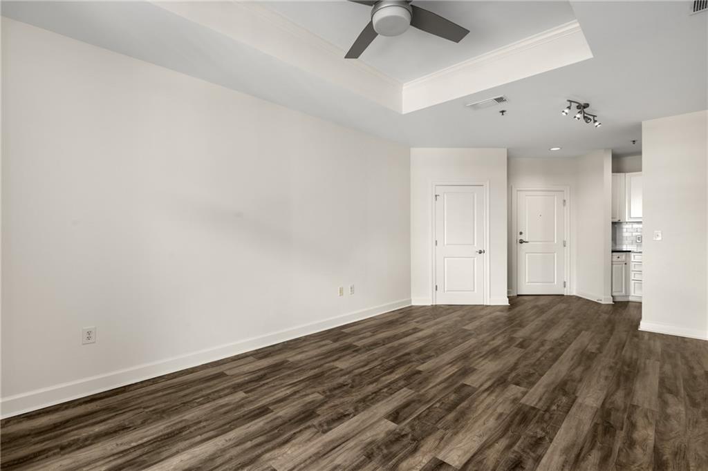 325 East Paces Ferry Road Northeast, Unit 1704 Atlanta, GA 30305 - Photo 25 of 29 a view of an empty room and wooden floor